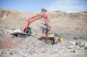 An excavator loads rock at the Stony Point Rock Quarry. The company supplies products for construction and landscape companies, serving wholesale and retail customers for major construction projects and individual home landscaping needs. 