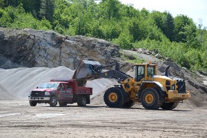 A Volvo L220G wheel loader fills a customer’s truck.