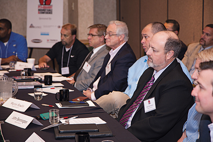 Participants listen to a colleague during roundtable discussions. Photos by Clay Wieland.
