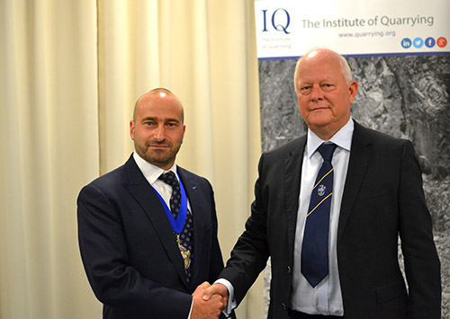 Miles Watkins, left, succeeds Anthony Morgan as president of the Institute of Quarrying. Photo courtesy of the Institute of Quarrying