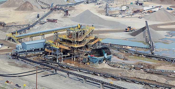 An aerial view of Inland Aggregates’ Spy Hill operation. From this angle, the primary crushing plant can be seen at the upper right while the secondary crushing plant is toward the center and the washing plant is at the bottom. Photo by Kevin Yanik