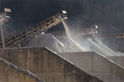 Stacker dust photo caption: Based on MSHA’s updated Spring 2018 unified agenda, respirable crystalline silica is considered a long-term action for rulemaking, creating uncertainty for what’s ahead. Photo: ISTOCK.COM/Nikola Nastasic