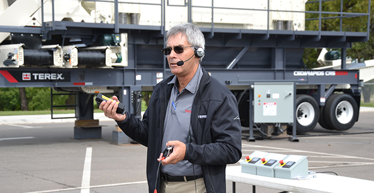 Ed Sauser demonstrates Terex MPS's CCM control system, which can be operated via a simple remote control.