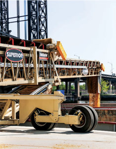 A 36-in. x 150-ft. TeleStacker telescoping radial stacking conveyor is at the center of the barge-loading operation. Photo courtesy of Superior Industries