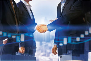Mergers and acquisitions are on the upswing, with a great deal of the action being smaller deals. Photo: iStock.com/NanoStockk