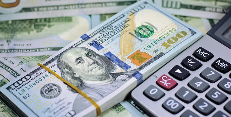 Money and calculator_StockImage: An aggregate business is now allowed to fully write off the entire cost of new purchases, utilizing 100 percent bonus depreciation. Photo: iStock.com/Wara1982