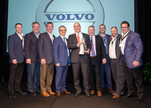 Alta Equipment representatives join Volvo CE reps to celebrate their successful partnership. From left are Evan Perry, district director, Volvo CE; Scott Sebastian, director of marketing, CE Group (Alta Equipment); Bruce Davis, director of sales, CE Group Michigan; Agako Nouch, VP sales North America, Volvo CE; Ryan Greenawalt, CEO, Alta Equipment; Stephen Roy, president of sales region Americas, Volvo CE; Aaron Dorgan, VP rental, CE Group; Mike Dahlen, regional VP Illinois, CE Group; Rob Chiles, president CE Group. Photo courtesy of Volvo CE