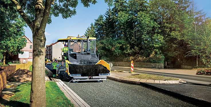 Recycled plastic, seen here being added to asphalt mix, could pave the way into the future. Photo courtesy of Volvo CE