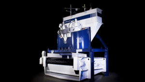 Ideal for use in clay-heavy material deposits, the Hydro-Clean is fed contaminated material via a hopper into its vertical drum. Photo courtesy of Haver & Boecker