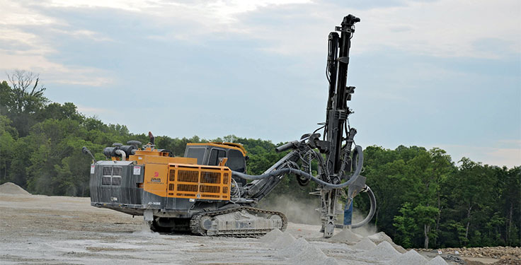 Quality Stone & Ready Mix has been utilizing a JD-1400E rock drill for about five years. Photo by Kevin Yanik