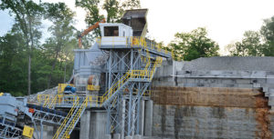 Site preparation, including excavating and pre-splitting a face, was critical to lay the groundwork for Quality Stone & Ready Mix’s new primary crushing plant. Photo by Kevin Yanik.