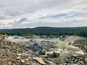 In addition to the CRJ3255 jaw plant, pictured in the distance at the far right, the portable spread includes a pair of CRC380XHLS cone-screen plants, a CRS820H 8-ft. x 20-ft. triple-deck finish screen and a CRS620H 6-ft. x 20-ft. triple-deck screen. Photo courtesy of Jamie Harthoorn.