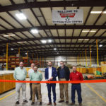 Montabert's staff cuts the ribbon to introduce the company's Nashville, Illinois, distribution center. Photo by Zach Mentz