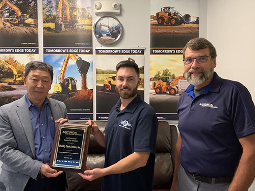 From left: M.S. Kang, president of Hyundai Construction Equipment Americas; Nick Moynihan, president of Quality Fleet Service; and Bill Klein, Hyundai's district manager for the Northeast. Photo courtesy of Hyundai