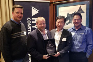 From left: HCEA's Shaun Galligan, NED's Jason Wainwright, HCEA's M.S. Kang and HCEA's Eli Bello celebrate NED's Dealer of the Year award. Photo courtesy of HCEA
