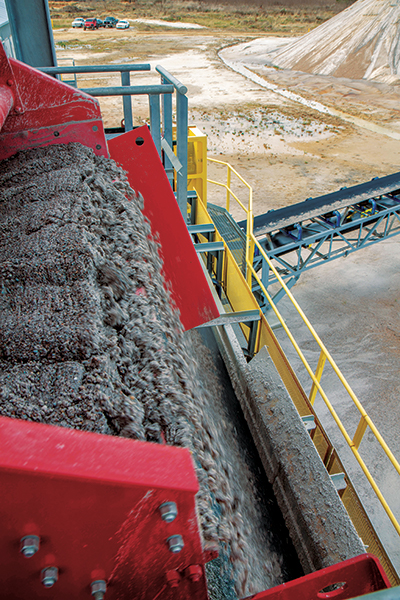 Motor wiring draped across a vibrating motor to the side of a dewatering screen is a dangerous condition. Check this and replace wiring as needed. Photo: McLanahan