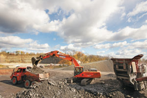 Gill Quarries utilizes a variety of equipment from Doosan in its mobile equipment fleet, including a DX350LC-5 excavator and DA30 articulated dump truck. Photo: Doosan