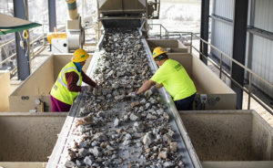 Associates at the Luck Stone Atlanta-Stephens Plant pick deleterious materials, such as wood, asphalt and plastic, from a conveyor belt. Photo: Luck Companies