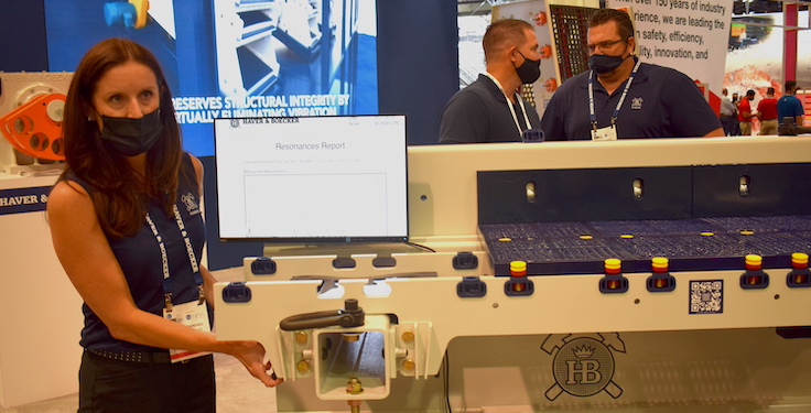 Haver & Boecker's Kristen Randall shows off the F-Class vibrating screen at MINExpo International 2021. Photo: P&Q Staff