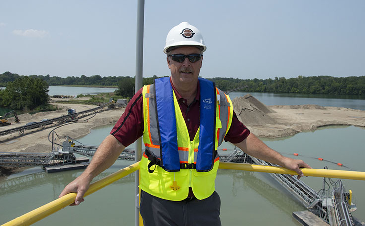 Barrett Paving’s Jim Meckstroth says the clamshell dredge is one of the largest capital investments Colas has made in North America. Photo: P&Q Staff