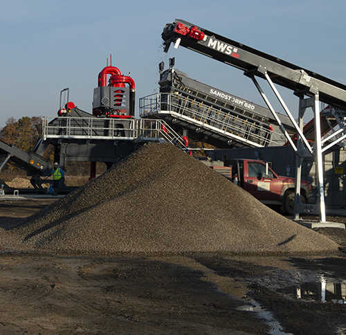 Arms Sand & Gravel’s Dan Mann is not only impressed with the production output of the wash plant, but the cleanliness of materials. Photo: P&Q Staff