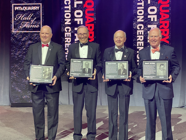 Chris Nawalaniec, left, Dave Thomey, EJ Burke and John Baker pose with plaques representing the class of 2021 and 2022. Photo: P&Q Staff