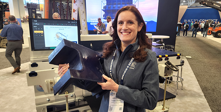 Kristen Randall, marketing manager at Haver & Boecker Niagara, shows off the company's Drop Guard wear liner at AGG1. According to Haver & Boecker Niagara, the polyurethane liner provides 100 percent cross beam protection for Niagara vibrating screens and can easily be installed on an entire screen deck in as little as 15 to 20 minutes. Photo: P&Q Staff