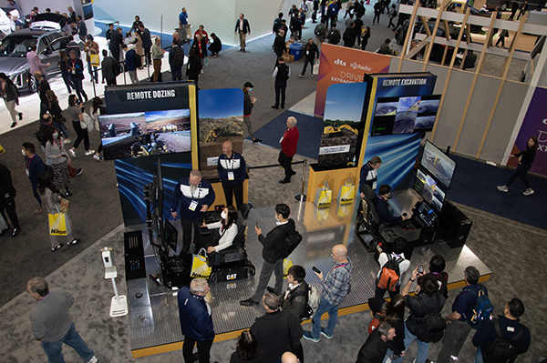 In addition to the 100-ton hauler, Caterpillar invited CES attendees to operate a dozer (left) and excavator remotely. Photo: P&Q Staff