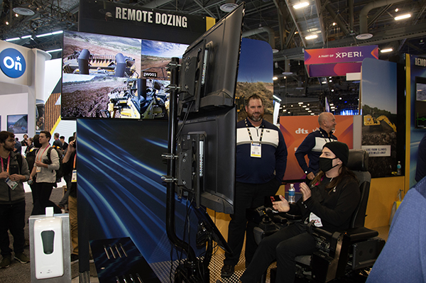 Those who hopped into the dozer simulator operated a machine in Arizona 445 miles away from Las Vegas. Photo: P&Q Staff