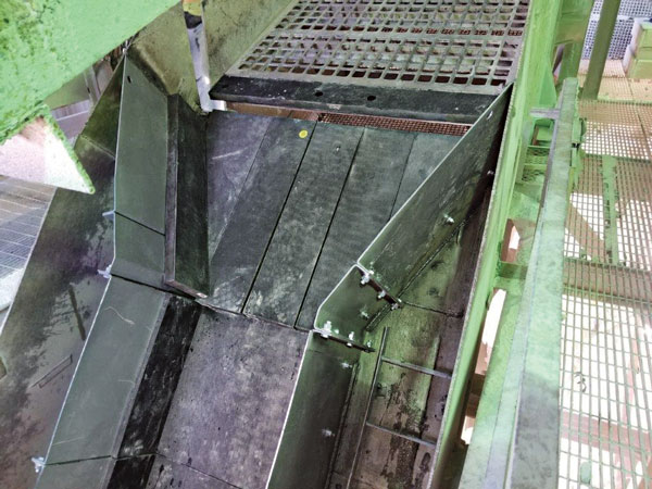 This scalping screen was fitted with rubber discharge lips, and the custom-designed chute handling large jaw crusher discharge rock was lined with rubber on the floor and sidewalls of the chute. The rubber lasted three times longer than AR steel, according to Kemper Equipment’s Greg Donecker. Photo: Greg Donecker
