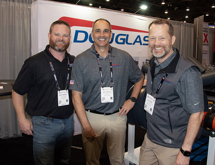 Douglas Manufacturing’s Jeff Carlisle (center) and Paul Ross (right) visited with Omni Powertrain Technologies’ Brent Marbut at ConExpo-Con/Agg. Photo: P&Q Staff