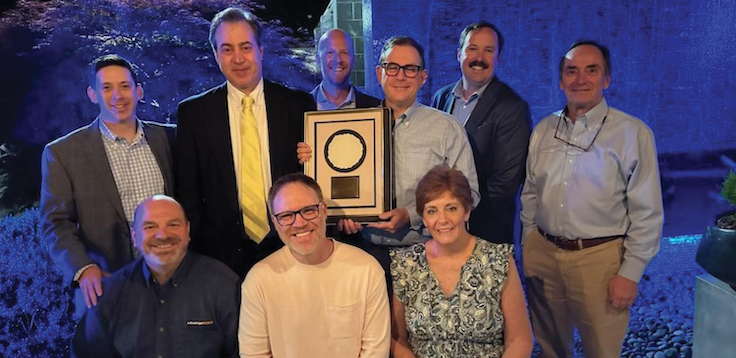 Adams Brothers has now earned five Eriez Merwin Awards. Pictured celebrating the victory from Adams Brothers and Eriez are (front row from left) Bill Dudenhoefer, Brent Lee and Micki Dargan, as well as (back row from left) Philemon Croft Jr., Dave Heubel, Nate Kubicki, Brian Stanley, Kevin Tignor and Malcom Marsh. Photo: Eriez