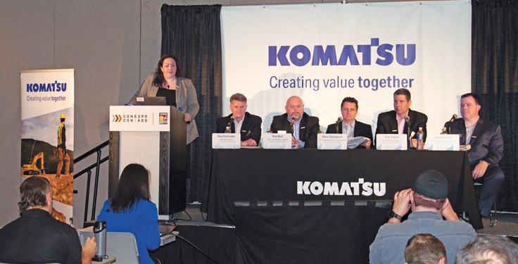 Komatsu North America chairman and CEO Rod Schrader, seated at the far left during a ConExpo-Con/Agg press conference, says time will ultimately tell how electric equipment fares in various construction markets. Photo: P&Q Staff