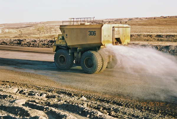 Some operations convert their older haul trucks into water tanks to spray down haul roads for dust suppression. This keeps dirt from migrating from haul roads and reduces dust in the air. Photo: Philippi-Hagenbuch