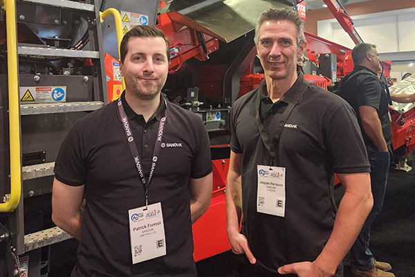Patrick Forrest (left) and Jesper Persson ¬¬provided P&Q with insights about Sandvik’s QI353 mobile impact crusher, which was on display at the show. Photo: P&Q Staff