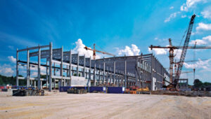 The private sector’s increasing interest in establishing manufacturing capabilities in the U.S. is stimulating the construction materials market. Photo: graemenicholson/E+/Getty Images