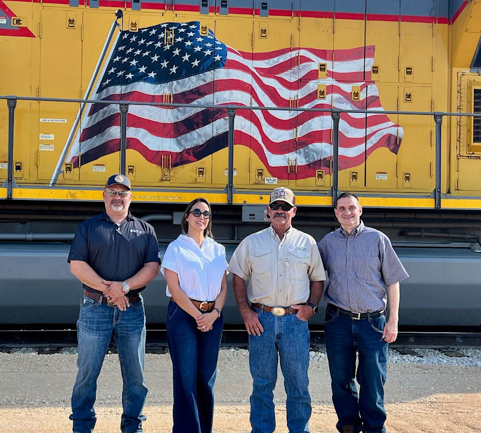 Anderson Columbia president Joey Anderson III (third from left) joined representatives from Union Pacific Railroad at a ribbon-cutting ceremony for the new rail line at the company’s Tejas Quarry. Pictured alongside Anderson are Bo Mushinski (left), Barbara Koehler (second from left) and Kevin Klein (far right). Photo: Anderson Columbia