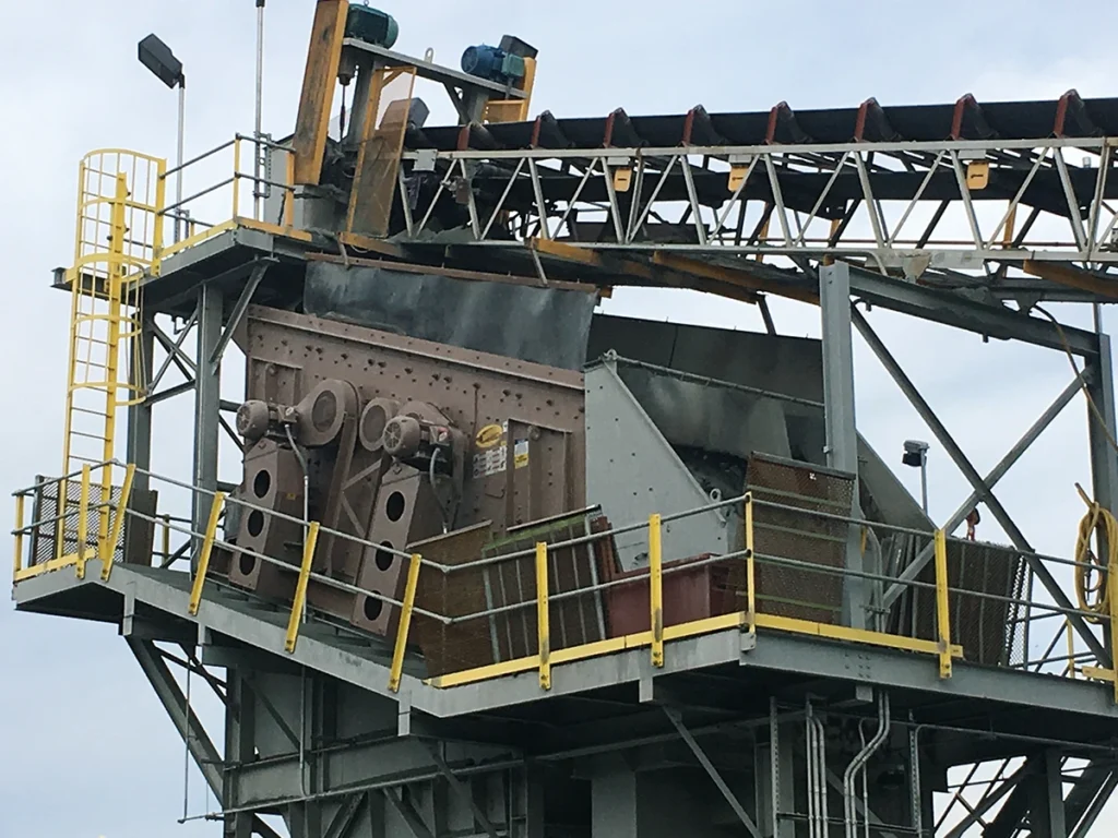 Inclined screens like this one rely on gravity and aggressive stroke to move material efficiently across the deck, making them a staple in high-volume aggregate screening circuits. (Photo: Deister Machine Co.)