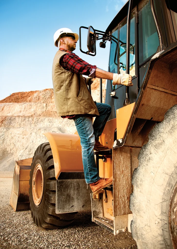 Always maintain three points of contact when climbing ladders or accessing mobile equipment. (Photo: tomasworks/E+/Getty Images)