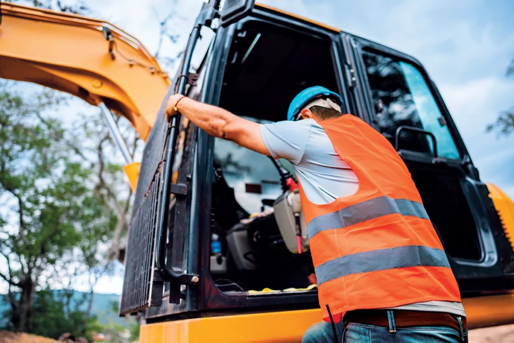 To reduce injuries when workers access or dismount mobile equipment, producers can take several steps. These include training on three points of contact, marking designated handholds and applying grip tape. (Photo: Frazao Studio Latino/E+/Getty Images)