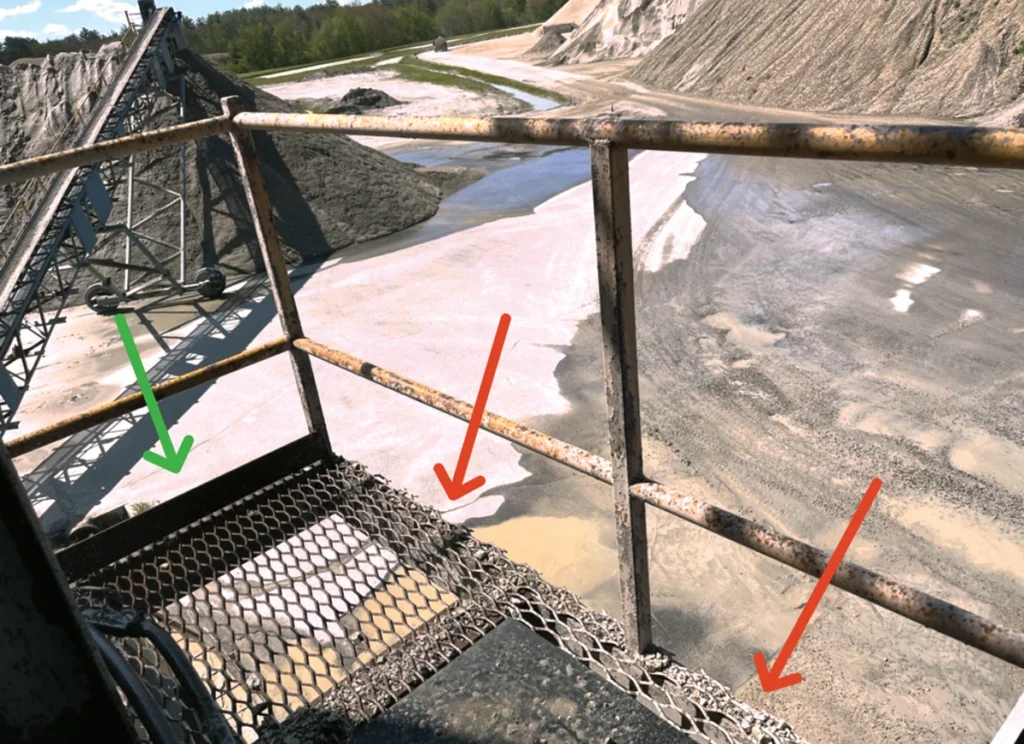 The red arrows here point at missing toe kicks on a guardrail system. (Photo: Steve Fuller)