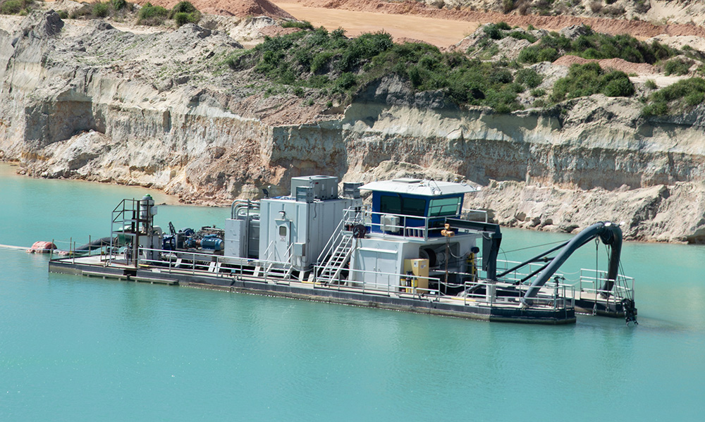 With a dredge feeding the wash plant, Blue Water Industries utilizes a feed-regulated sump as a primary surge tank to manage variability in the feed solids. Photo: P&Q Staff
