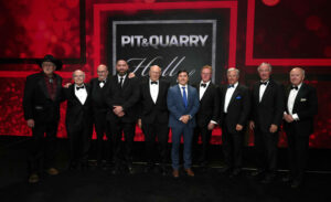 Eight of the 44 members of the Pit & Quarry Hall of Fame were in St. Louis. Pictured from left are Neil Hise, Ron DeDiemar, Paul Mellott, Jeremy Polcyn (representing Edgar B. Symons), Gerry Bauer, Fernando Moya (representing Symons), Tom Hill, George Sidney, Don James and E.J. Burke. Photo: Pit & Quarry