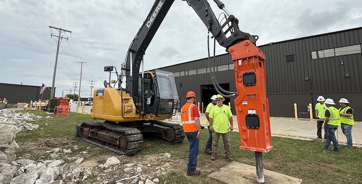 Attendees at NPK's Demo Days had the chance to operate the company's GHD-10 hydraulic hammer to break recycled concrete. Photo: P&Q Staff