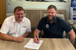 Mike Maher of ProTrack (right) joins Matt Dickson of Finlay to celebrate the companies' new partnership. Photo: Finlay