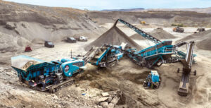 A rental spread consisting of a Premiertrak 400X jaw crusher, a 1300 Maxtrak cone crusher, a Chieftain 2100X inclined screen, and an MGL Engineering stacking conveyor was critical to Callahan Ag & Gravel’s success on a recent project. Photo: Powerscreen of Washington
