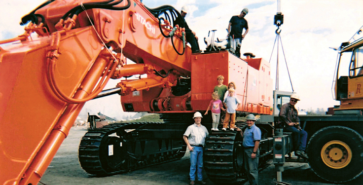 The McNeely family recreated a 20-year-old group photo (shown here) with a 2025 shot that created a new memory. (Photo: Hills Machinery)