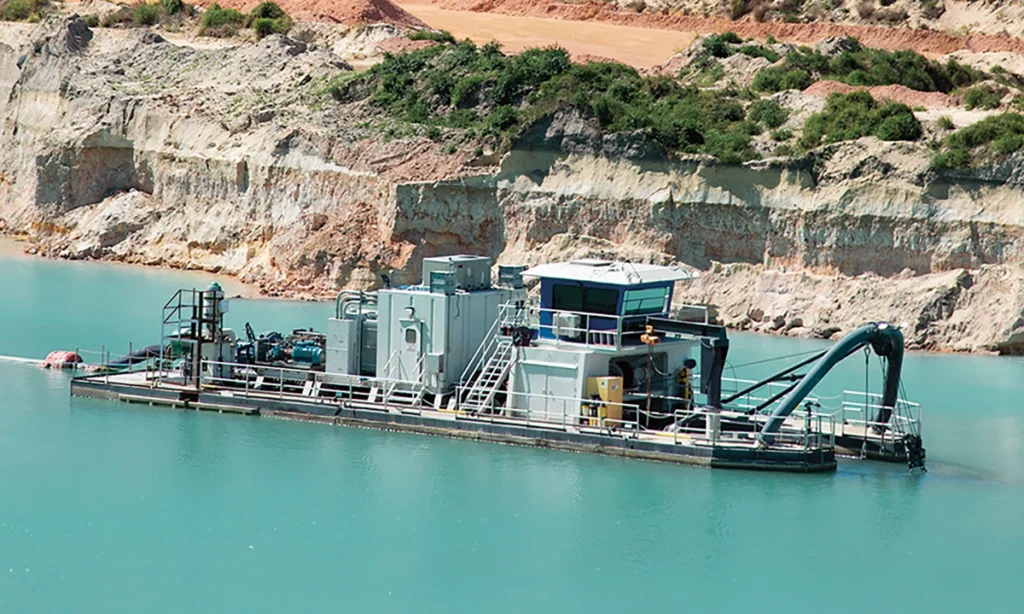 A cutterhead dredge mines sand and gravel from beneath the water’s surface, transporting it as slurry to shore for processing. (Photo: P&Q Staff)