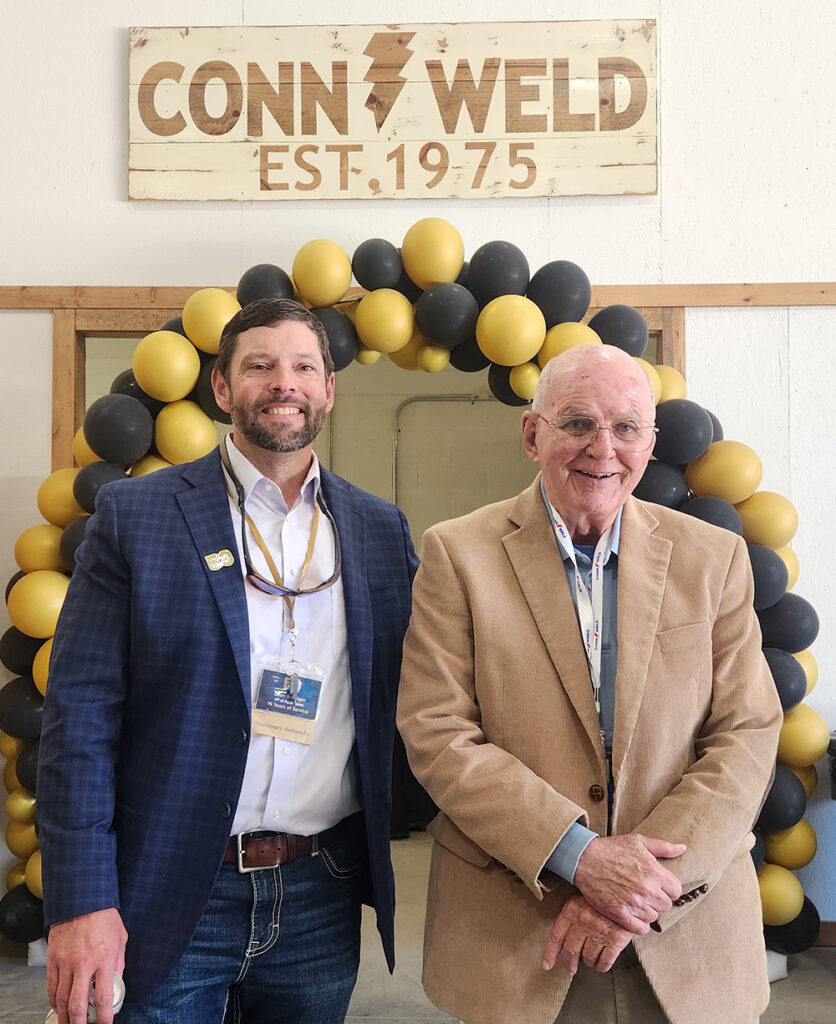 Sean Weisiger, vice president of aggregates at Conn-Weld Industries (left) shares a moment with Mike Connolly, son of Conn-Weld founder Jim Connolly, during the 50th anniversary celebration Oct. 16. Photo: P&Q Staff