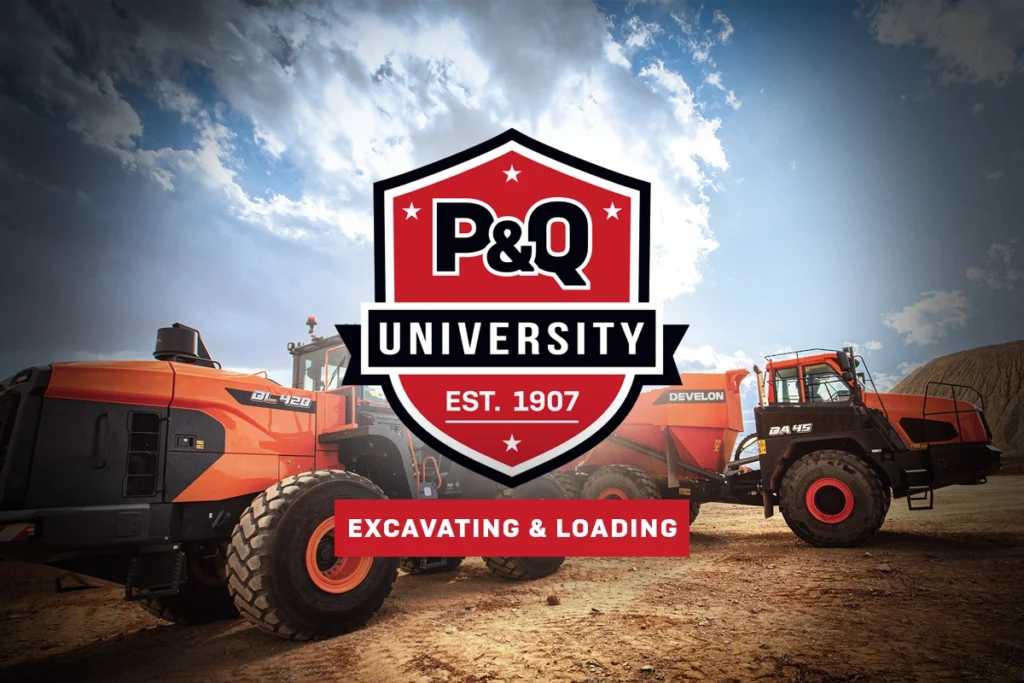 Photo of a wheel loader transferring material into a haul truck